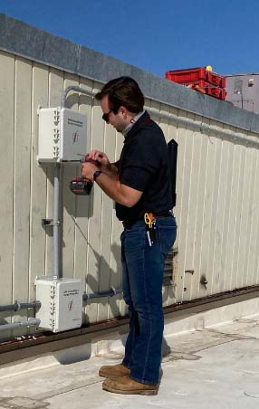 Technician finishing a GPS antenna install.
